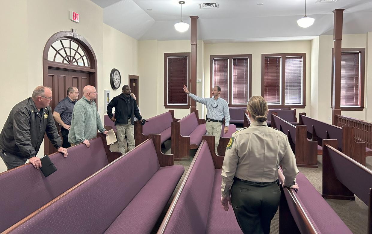 Glascock County Sheriff Jeremy Kelley leads a tour of the county's courthouse for members of the Georgia Sheriff's Association.