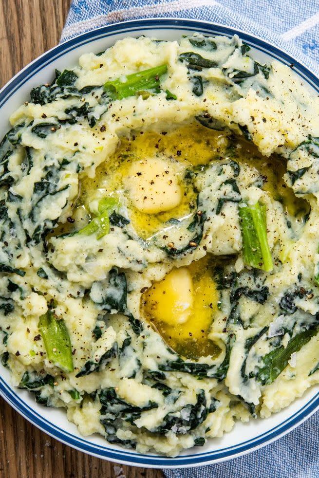 <p>Colcannon is a traditional Irish dish made of <a href="https://www.delish.com/cooking/recipe-ideas/recipes/a50630/perfect-mashed-potatoes-recipe/" rel="nofollow noopener" target="_blank" data-ylk="slk:creamy mashed potatoes;elm:context_link;itc:0;sec:content-canvas" class="link ">creamy mashed potatoes</a> and some green veggie. Most typically you'll find <a href="https://www.delish.com/cooking/a23026249/how-to-cook-cabbage/" rel="nofollow noopener" target="_blank" data-ylk="slk:cabbage;elm:context_link;itc:0;sec:content-canvas" class="link ">cabbage</a> or kale, paired with some green aromatics like leeks and chives. Here, we opt for a scallion and kale combo for vibrant color and deeper, nuttier flavors.<br><br>Get the <strong><a href="https://www.delish.com/cooking/recipe-ideas/a30778318/colcannon-recipe/" rel="nofollow noopener" target="_blank" data-ylk="slk:Best Colcannon recipe;elm:context_link;itc:0;sec:content-canvas" class="link ">Best Colcannon recipe</a></strong>.</p>