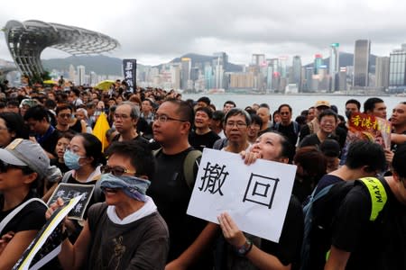 Anti-extradition bill protesters march to West Kowloon Express Rail Link Station in Hong Kong's tourism district of Tsim Sha Tsui