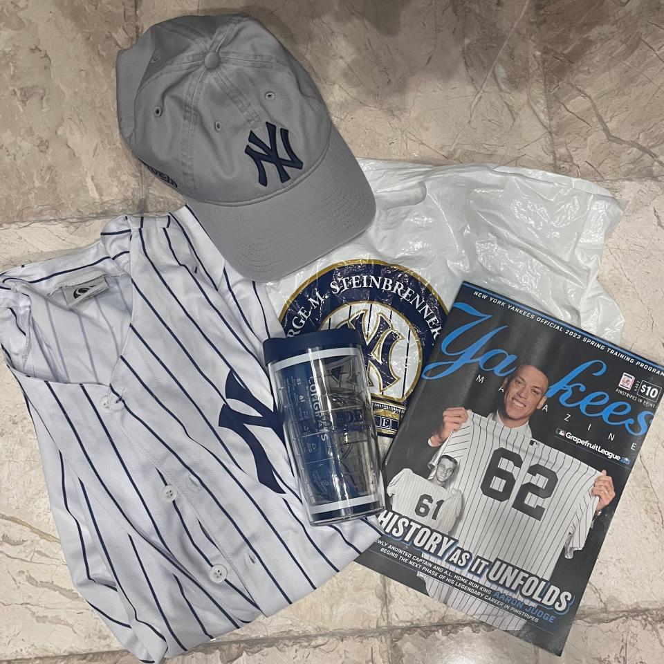 Yankees magazine, shirt, baseball hat, and cup, Lucia Bailey, "I Drained My Savings For The Yankee Inside Experience and It Was a Huge Disappointment. "