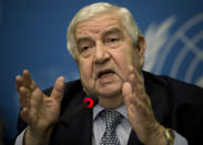 Syria's Foreign Minister and head of the Syrian government delegation Walid al-Moallem gestures during a press conference at the United Nations headquarters in Geneva, Switzerland, Friday, Jan. 31, 2014. U.N.-Arab League mediator Lakhdar Brahimi tried to put a positive spin Friday on the first face-to-face meetings in three years between Syria's warring sides, suggesting they reconvene Feb. 10 for a fresh attempt at bridging the chasm between them. (AP Photo/Anja Niedringhaus)