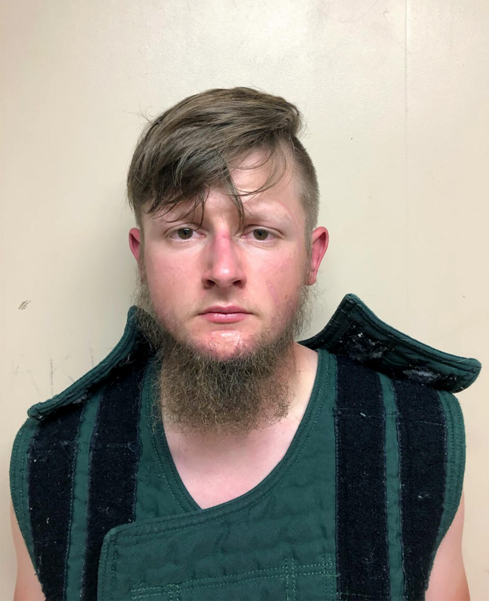 This booking photo provided by the Crisp County Sheriff's Office shows Robert Aaron Long on Tuesday, March 16, 2021. Long was arrested as a suspect in the fatal shootings of multiple people at three Atlanta-area massage parlors, most of them women of Asian descent, authorities said.  (Crisp County Sheriff's Office via AP)