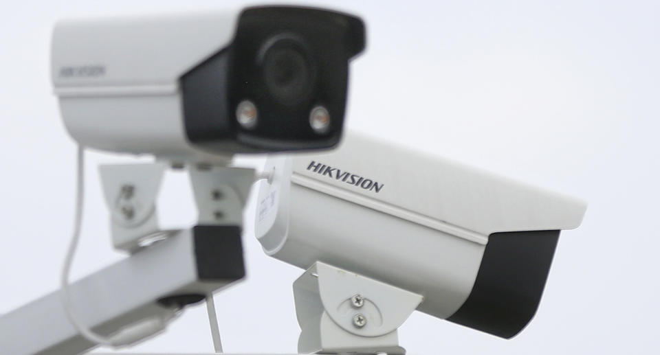 Two Hikvision cameras are seen watching over an area.