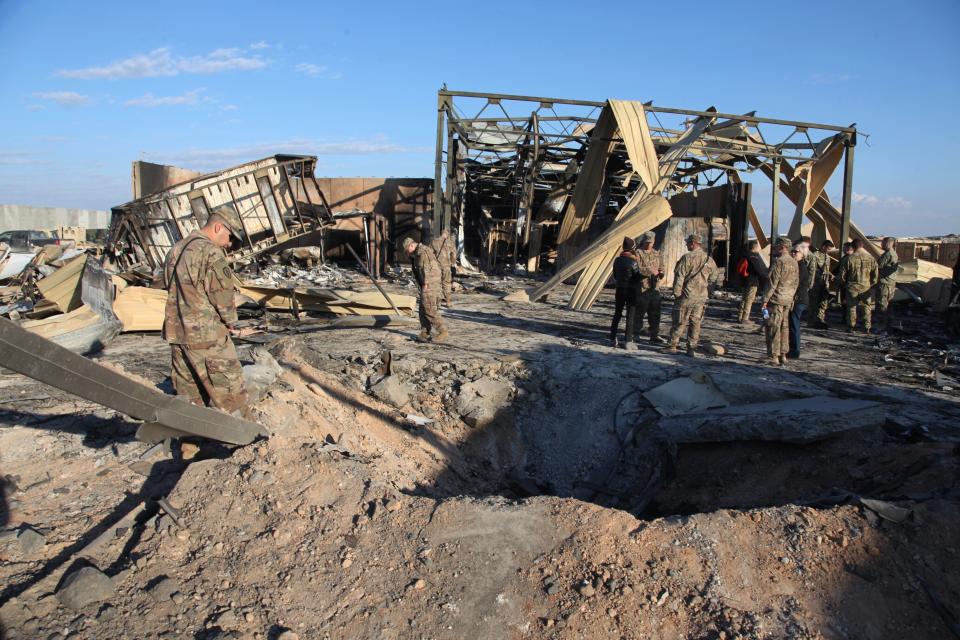 In this Monday, Jan. 13, 2020, photo, U.S. troops stand near their residence area that was destroyed by Iranian bombing at Al-Asad air base, in Anbar, Iraq. (Photo: ASSOCIATED PRESS)