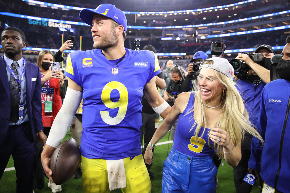 INGLEWOOD, CALIFORNIA - JANUARY 30: Matthew Stafford #9 of the Los Angeles Rams and wife Kelly Hall react after defeating the San Francisco 49ers in the NFC Championship Game at SoFi Stadium on January 30, 2022 in Inglewood, California. The Rams defeated the 49ers 20-17. (Photo by Christian Petersen/Getty Images)