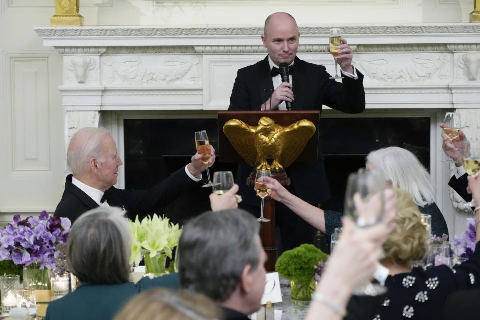 President Joe Biden raises a glass as the National Governors Association Vice Chair Utah Gov. Spencer Cox toasts during a dinner reception for governors and their spouses in the State Dining Room of the White House, Saturday, Feb. 11, 2023, in Washington. (AP Photo/Manuel Balce Ceneta)