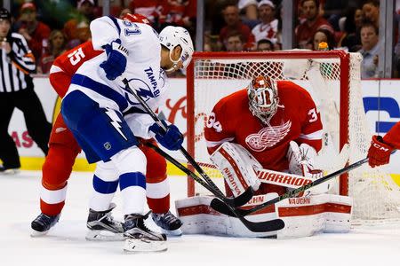 Apr 17, 2016; Detroit, MI, USA; Detroit Red Wings goalie Petr Mrazek (34) makes the save against Tampa Bay Lightning center Valtteri Filppula (51) during the first period in game three of the first round of the 2016 Stanley Cup Playoffs at Joe Louis Arena. Rick Osentoski-USA TODAY Sports