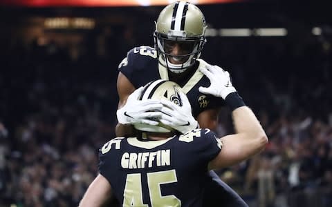 New Orleans Saints tight end Garrett Griffin (45) celebrates with wide receiver Michael Thomas (13) after scoring a touchdown against the Los Angeles Rams during the first quarter in the NFC Championship game at Mercedes-Benz Superdome. - Credit: USA TODAY