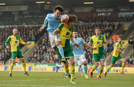 Manchester City's David Silva in action with Norwich City's Timm Klose. Norwich City v Manchester City - Barclays Premier League - Carrow Road - 12/3/16. Action Images via Reuters / Tony O'Brien Livepic