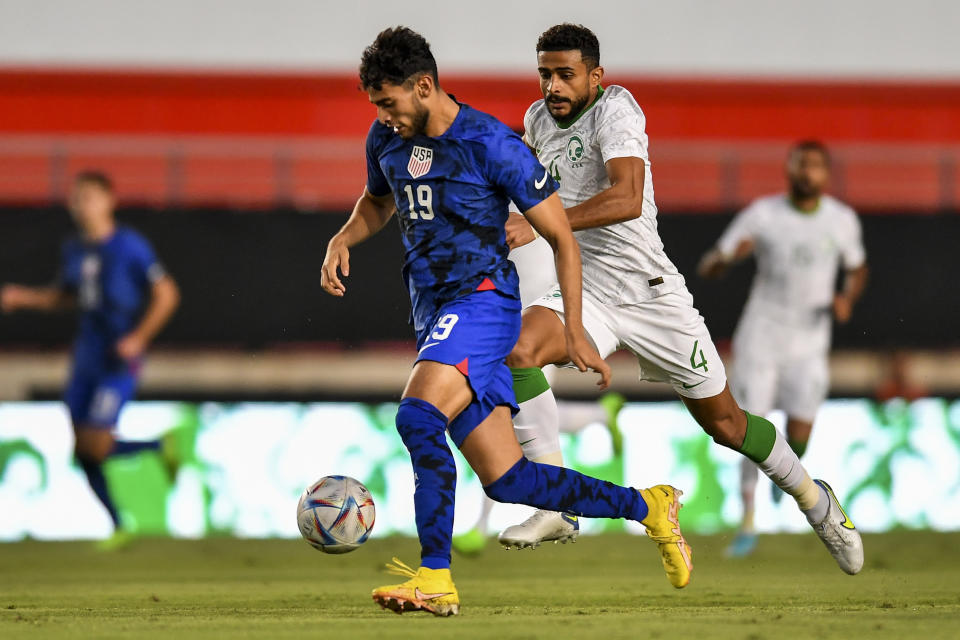 United States' Ricardo Pepi, left, duels for the ball with Saudi Arabia's Abdulelah Ali Alamri during the international friendly soccer match between Saudi Arabia and United States in Murcia, Spain, Tuesday, Sept. 27, 2022. (AP Photo/Jose Breton)