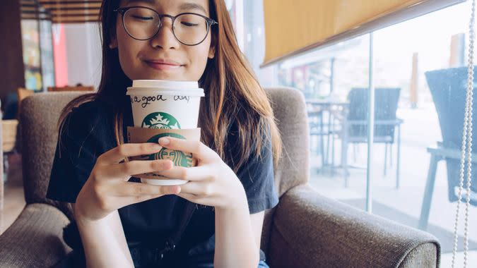 girl drinking Starbucks Coffee