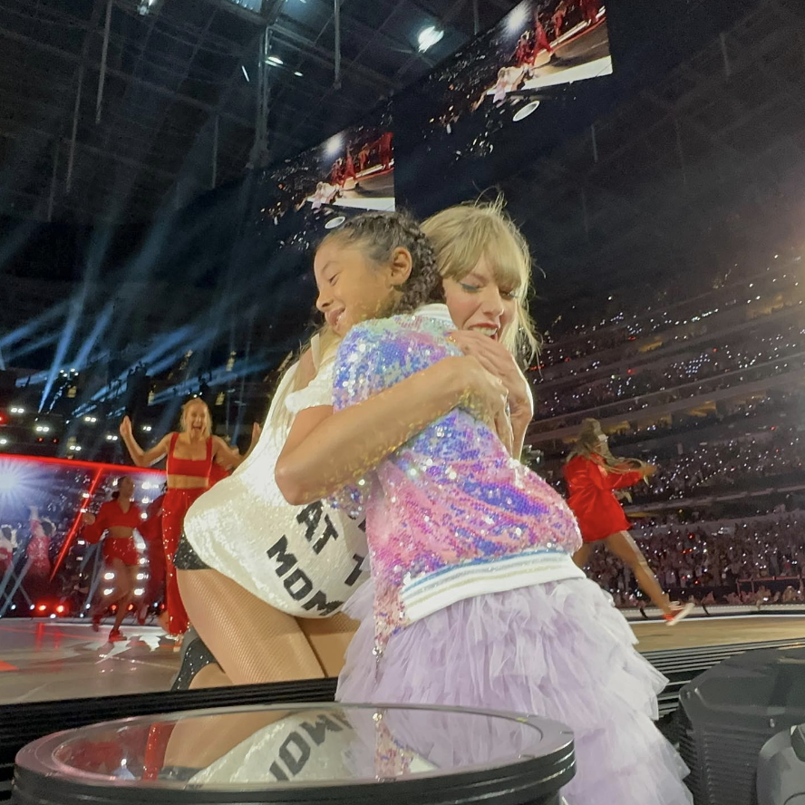 Taylor hugging Bianka