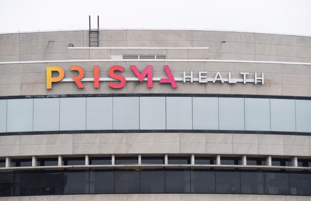 The sign for Prisma Health facing East Court Street on the building located at 300 East McBee Ave. in Greenville.