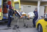 Paramedics transfer a survivor of a shipwreck at a hospital, on the northeastern Aegean Sea island of Lesbos, Greece, Sunday, Nov. 26, 2023. A cargo ship sank off the Greek island of Lesbos early Sunday, leaving 13 crew members missing and one rescued, authorities said. The Raptor, registered in the Comoros, was on its way to Istanbul from Alexandria, Egypt, carrying 6,000 tons of salt, the coast guard said. It had a crew of 14, including eight Egyptians, four Indians and two Syrians, the coast guard said.(AP Photo/Panagiotis Balaskas)