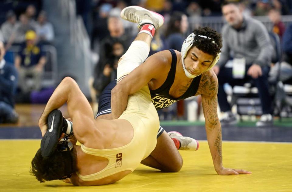 Penn State’s Roman Bravo-Young controls Minnesota’s Aaron Nagao in the 133 lb championship bout of the Big Ten wrestling championships at the Crisler Center on Sunday, March 5, 2023.
