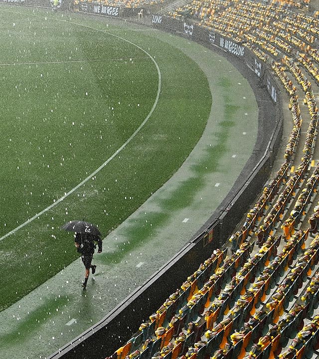 Heavy rain, pictured here hitting Brisbane before the 2020 AFL grand final at the Gabba. 