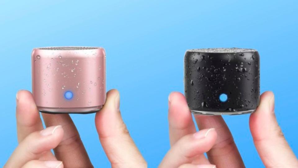 two portable mini speakers