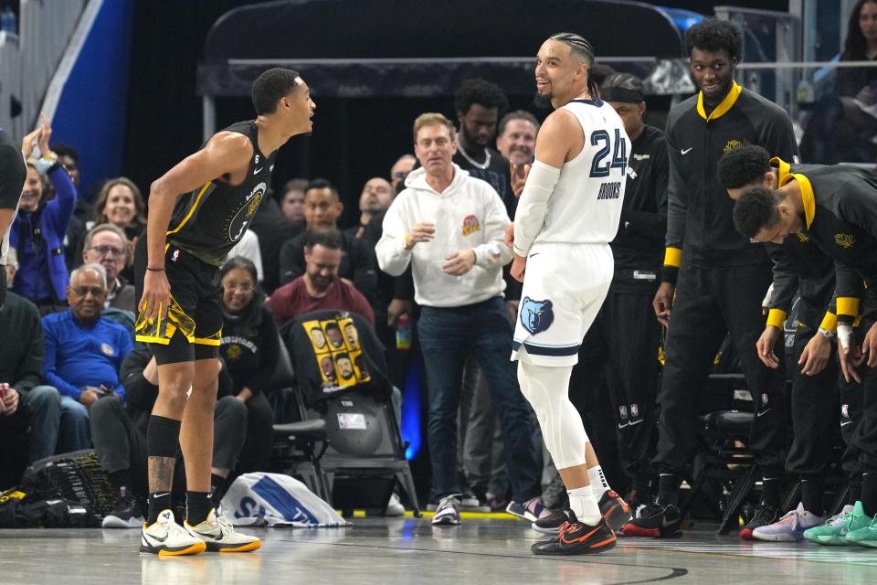 Dec 25, 2022; San Francisco, California, USA; Golden State Warriors guard Jordan Poole (3) talks to Memphis Grizzlies forward Dillon Brooks (24) after scoring during the first quarter at Chase Center. Mandatory Credit: Darren Yamashita-USA TODAY Sports