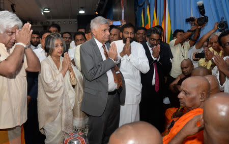 Sri Lanka's Prime Minister Ranil Wickremesinghe prays after assuming duties in Colombo, Sri Lanka December 16, 2018. REUTERS/Stringer
