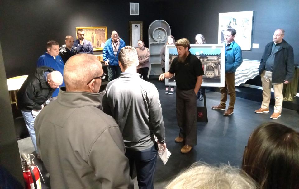 Ernie Hershberger, owner of Homestead Furniture, led Holmes County Chamber of Commerce members on a guided tour of the Met Collection at Abner Henry Furniture.