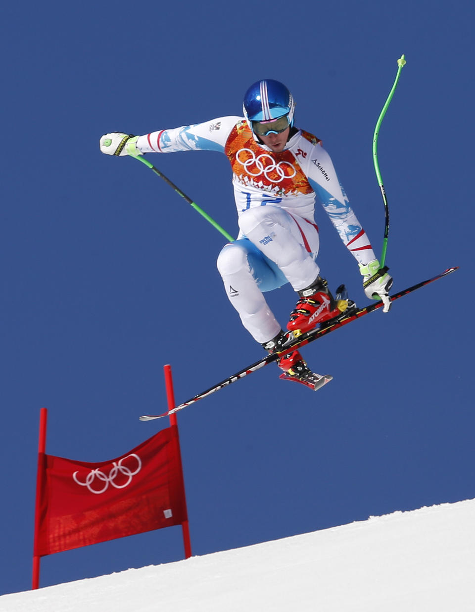 Austria's Matthias Mayer makes a jump during a men's downhill training run for the Sochi 2014 Winter Olympics, Saturday, Feb. 8, 2014, in Krasnaya Polyana, Russia.(AP Photo)