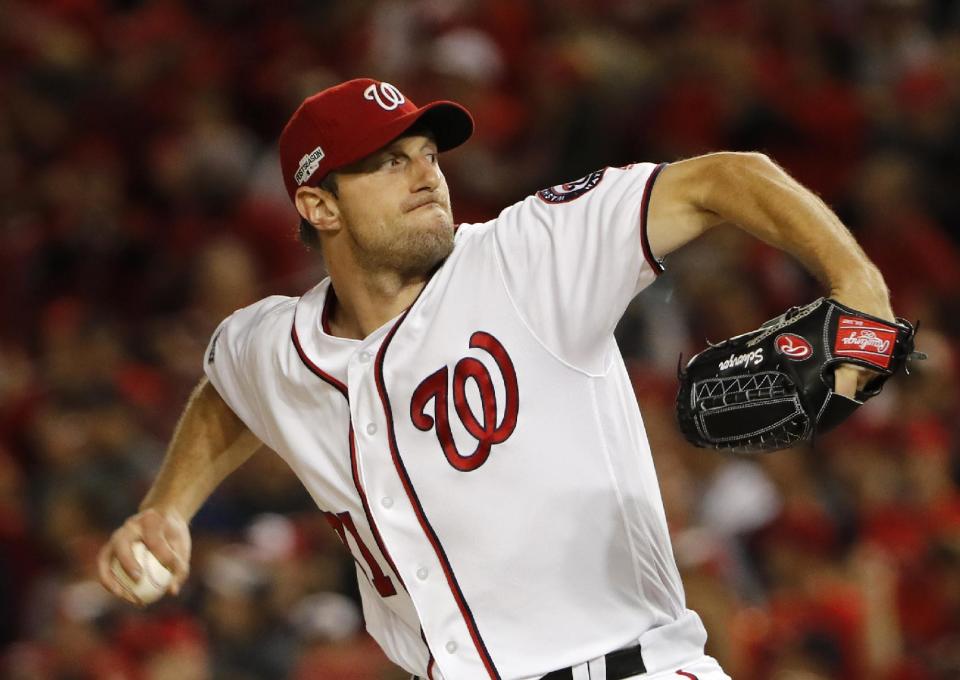 FILE - In this Oct. 13, 2016 file photo, Washington Nationals starting pitcher Max Scherzer pitches in the first inning in Game 5 of baseball's National League Division Series against the Los Angeles Dodgers at Nationals Park in Washington. Scherzer is dealing with pain from a fractured knuckle on his pitching hand that arose late last year, and Washington Nationals manager Dusty Baker says the team is making plans in case his ace isn't ready to go when next season begins. (AP Photo/Pablo Martinez Monsivais, File)