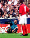 FILE - In this Oct. 7, 2000 file photo England's David Seaman sits on the ground after letting in a goal while Nick Barmby looks on during the group nine World Cup qualification match England versus Germany at Wembley stadium in London. The last game at the old Wembley turned out to be Kevin Keegan's last game in charge of England's national team. The coach decided to quit while seeking privacy in a bathroom cubicle shortly after Dietmar Hamann's free kick squirmed through the hands of goalkeeper David Seaman. (AP Photo/Christof Stache, File)