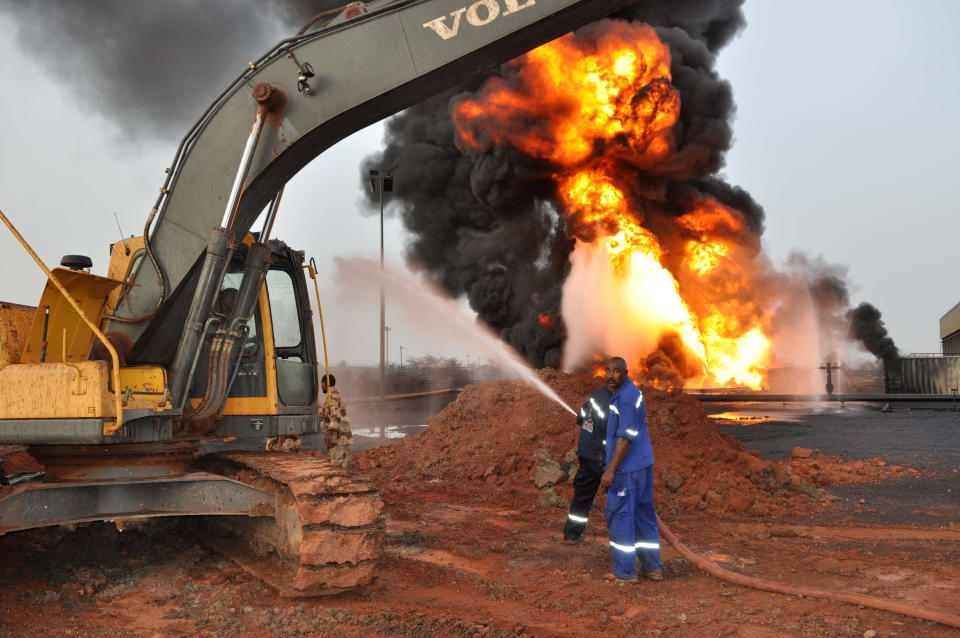 In this Sunday, April 22, 2012 photo, fire billows up from an oil field that caught on fire in Heglig, Sudan. An official says Sudanese jets bombed three areas in South Sudan's Unity State, including a major oil field. South Sudan military spokesman Col. Philip Aguer said Antonov bombers accompanied by MiG 29 jets bombed the town of Abiemnom in Unity State and the Unity State oil field. (AP Photo/Abd Raouf)