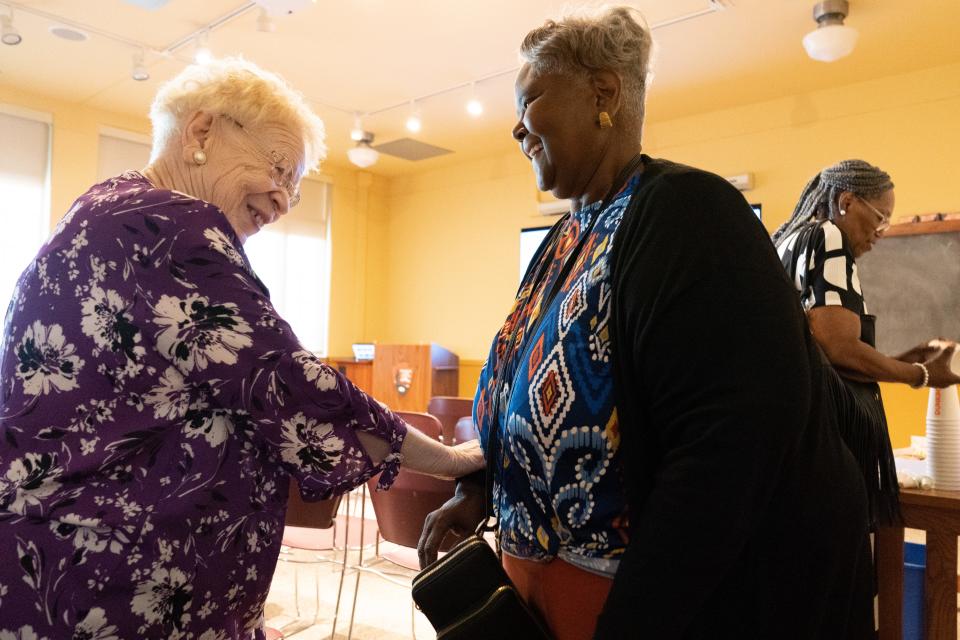 Alice Lee, left, smiles with Norma Avery after a special event Wednesday commemorating the 69th anniversary of the Brown v. Board of Education Supreme Court case at the National Historic Site.