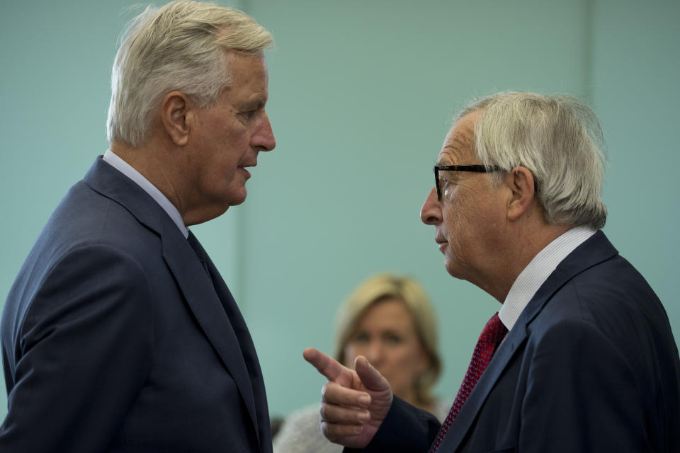 European Commission President Jean-Claude Juncker, right, talks to EU chief Brexit negotiator Michel Barnier prior a weekly meeting at the European Commission headquarters in Brussels, Wednesday, Oct. 17, 2018. European Union leaders are converging on Brussels for what had been billed as a "moment of truth" Brexit summit. (AP Photo/Francisco Seco)