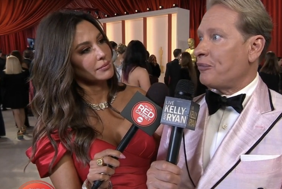 An interviewer talking with Carson Kressley