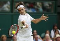 Roger Federer of Switzerland hits a shot during his match against Sam Querrey of the U.S.A. at the Wimbledon Tennis Championships in London, July 2, 2015. REUTERS/Stefan Wermuth