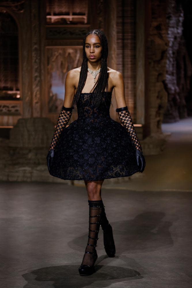 A model in black hooped dress on the catwalk for Dior in Paris