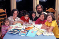 <p>Recognize the child fourth from the left? That's actor Joaquin Phoenix as a boy with his family in their Los Angeles home. His brother, River, who <a href="https://people.com/movies/inside-the-life-of-river-phoenix-the-beloved-actor-who-died-at-23/" rel="nofollow noopener" target="_blank" data-ylk="slk:tragically died of a drug overdose;elm:context_link;itc:0;sec:content-canvas" class="link ">tragically died of a drug overdose</a> in October 1993, in farthest right. The photo was taken by Dianna Whitley. </p>