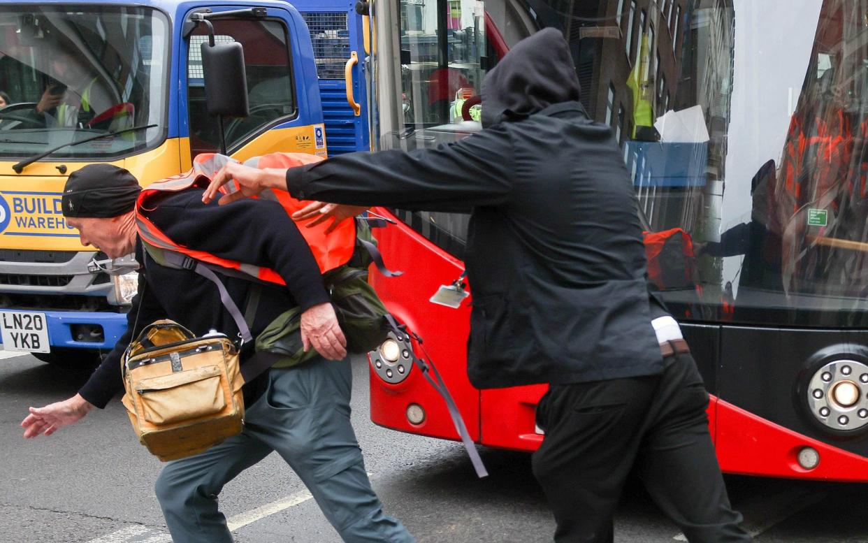 Arriva bus driver apparently pushes Just Stop Oil protester during a slow walk protest - Martyn Wheatley / i-Images