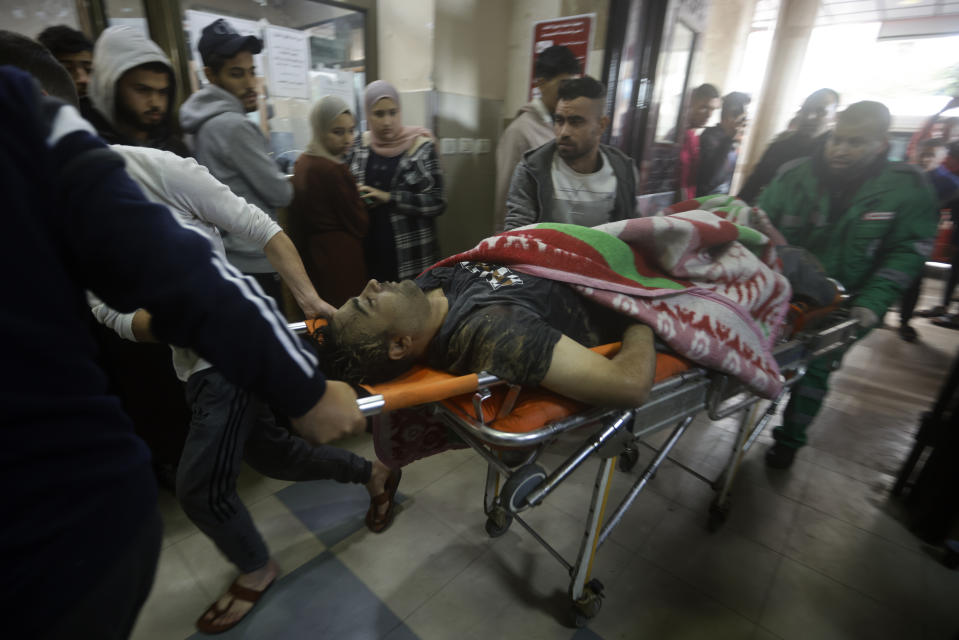 Palestinians wounded in the Israeli bombardment of the Gaza Strip arrive to Nasser hospital in Khan Younis, Thursday, Dec. 14, 2023. (AP Photo/Mohammed Dahman)