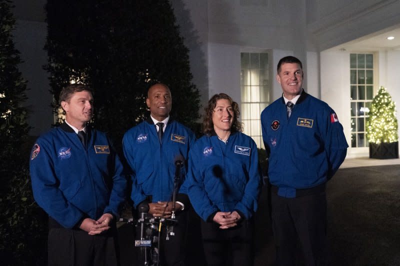 Artemis II crew members Reid Wiseman (L), Victor Glover (2nd L), Christina Hammock Koch (2nd R), and Jeremy Hansen (R) speak to media in December 2023 outside the White House after meeting with U.S. President Joe Biden. They are expected to be the first crew, and the first international crew, to reach the moon since 1972. File Photo by Chris Kleponis/UPI