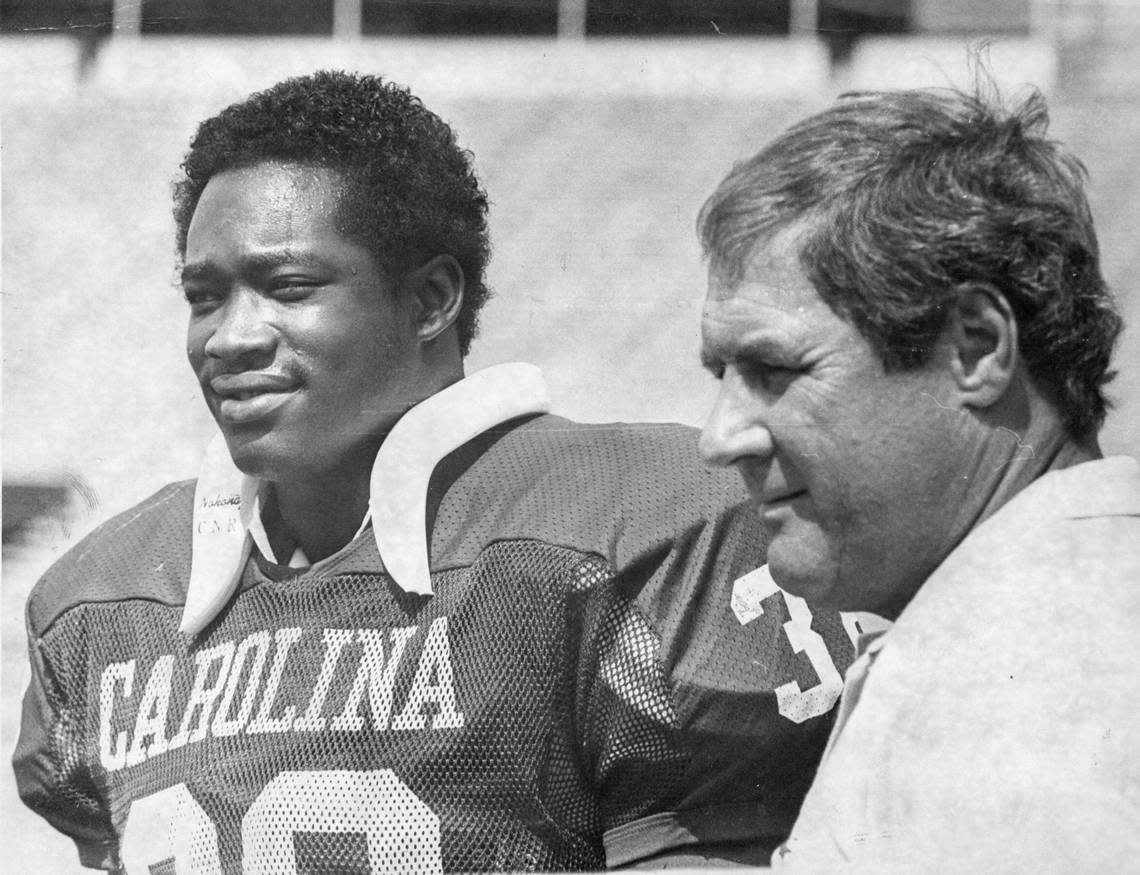 George Rogers played football for South Carolina from 1976-1980. He won the Heisman Trophy in 1980. Here he is photographed with head coach Jim Carlen, who recruited Rogers successfully out of Duluth, Ga., in part by telling him he might be able to start as a freshman.