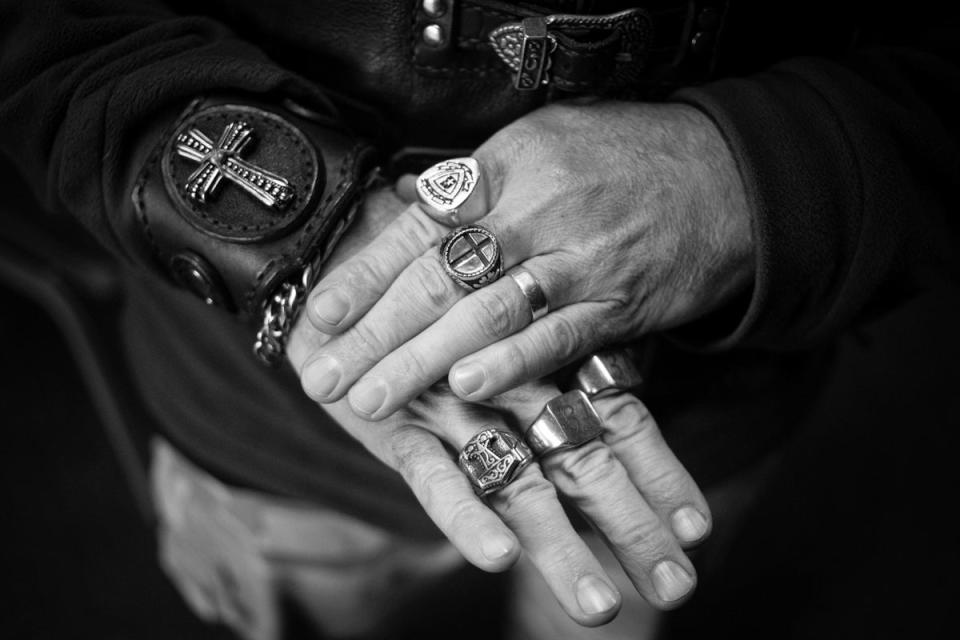 A CMA member simply known as ‘H’ shows his Christian rings and armband during the annual CMA South Africa national rally (EPA)