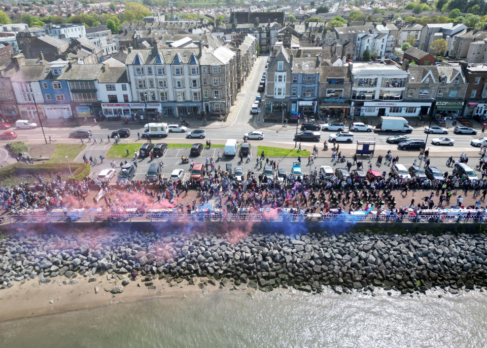 The Coronation Carnival Parade makes its way along the promenade during celebrations for the Big Lunch on the prom, in Morecambe, Britain, May 7, 2023. REUTERS/Molly Darlington