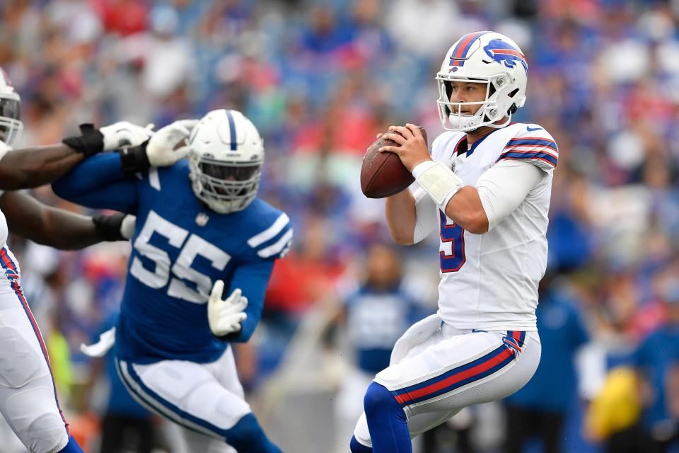 Buffalo Bills quarterback Kyle Allen (9) drops back as Indianapolis Colts defensive end Khalid Kareem (55) applies pressure during the first half of an NFL preseason football game in Orchard Park, N.Y., Saturday, Aug. 12, 2023. (AP Photo/Adrian Kraus)