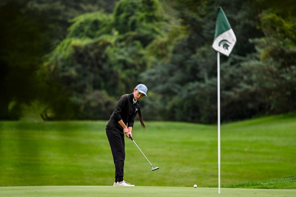 Okemos' Alena Li putts on the 7th hole during the CAAC Open at Forest Akers East Golf Course on Monday, Sept. 23, 2024, in East Lansing.