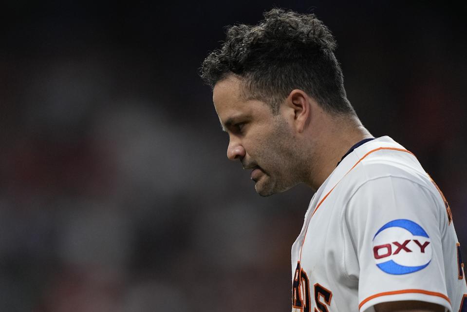 Houston Astros' Jose Altuve reacts after being called out during the eighth inning of Game 1 of the baseball AL Championship Series against the Texas Rangers Sunday, Oct. 15, 2023, in Houston. (AP Photo/David J. Phillip)
