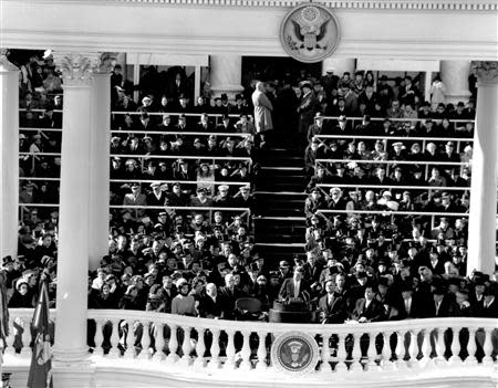 Former United States President John F. Kennedy (C) speaks during his inauguration ceremonies at the Capitol in Washington, in this handout photograph taken on January 20, 1961. REUTERS/Abbie Rowe/The White House/John F. Kennedy Presidential Library