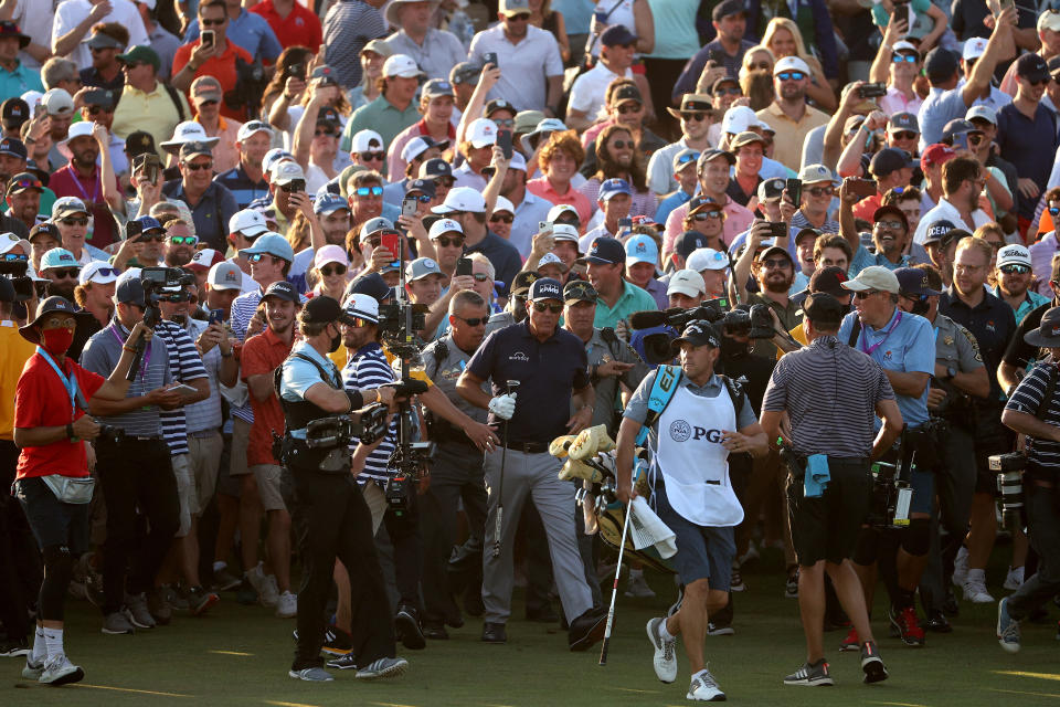 Phil Mickelson (pictured) was swamped by the crowd just before and after his 2021 PGA Championship triumph.