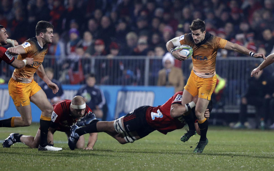Jaguares Joaquin Diaz Bonilla, right, is tackled as he looks for support during the Super Rugby final between the Crusaders and the Jaguares in Christchurch, New Zealand, Saturday, July 6, 2019. (AP Photo/Mark Baker)