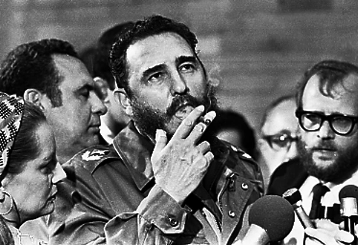 Fidel Castro smokes a cigar during interviews with the press in Havana during a visit of U.S. Senator Charles McGovern in this file photo from May 1975. Picture taken May 1975    REUTERS/Prensa Latina (CUBA)