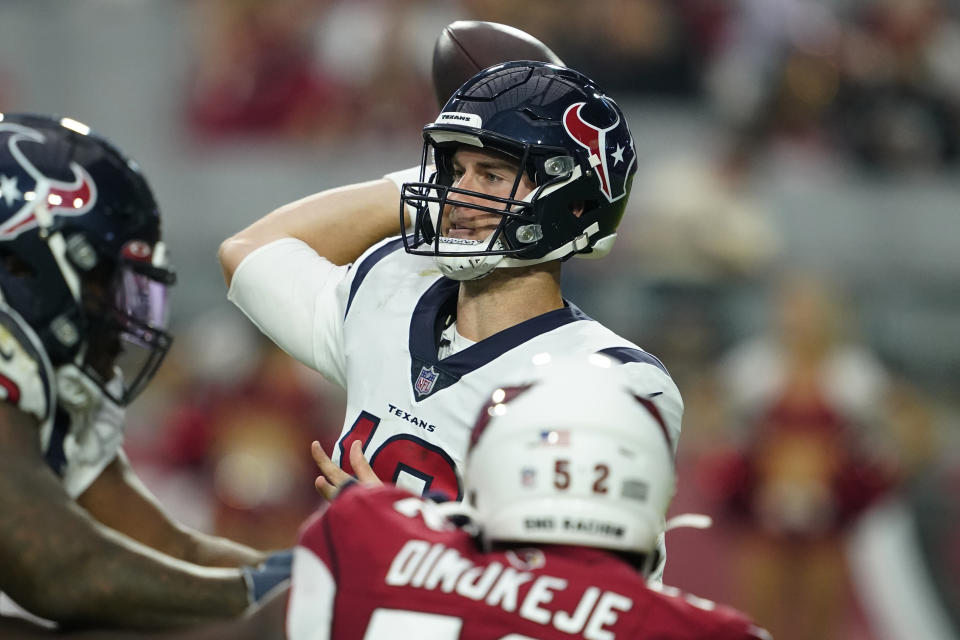 Houston Texans quarterback Davis Mills (10) throws as Arizona Cardinals linebacker Victor Dimukeje (52) pursues during the second half of an NFL football game, Sunday, Oct. 24, 2021, in Glendale, Ariz. (AP Photo/Darryl Webb)