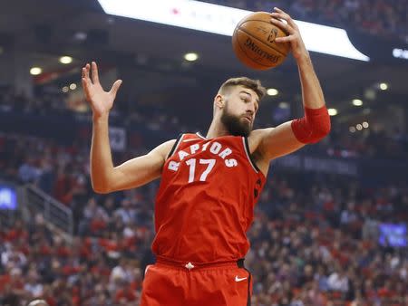 Oct 19, 2017; Toronto, Ontario, CAN; Toronto Raptors center Jonas Valanciunas (17) grabs a rebound against the Chicago Bulls during the first half at Air Canada Centre. Mandatory Credit: John E. Sokolowski-USA TODAY Sports