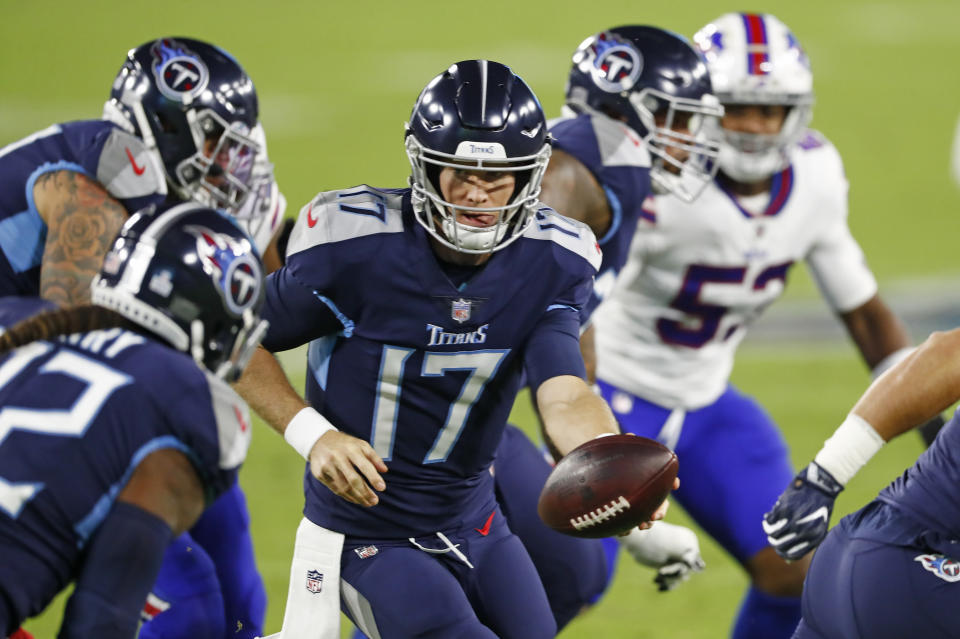 Tennessee Titans quarterback Ryan Tannehill (17) hands the ball off in the first half of an NFL football game against the Buffalo Bills Tuesday, Oct. 13, 2020, in Nashville, Tenn. (AP Photo/Wade Payne)